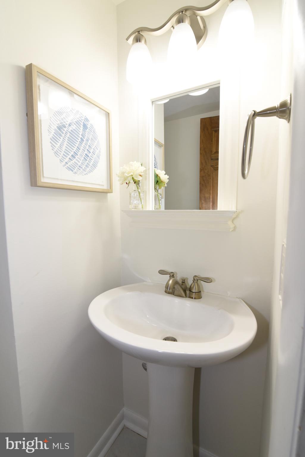 2334 Generation Drive Reston, VA 20191 - Photo 25 of 55 a bathroom with a sink and a mirror