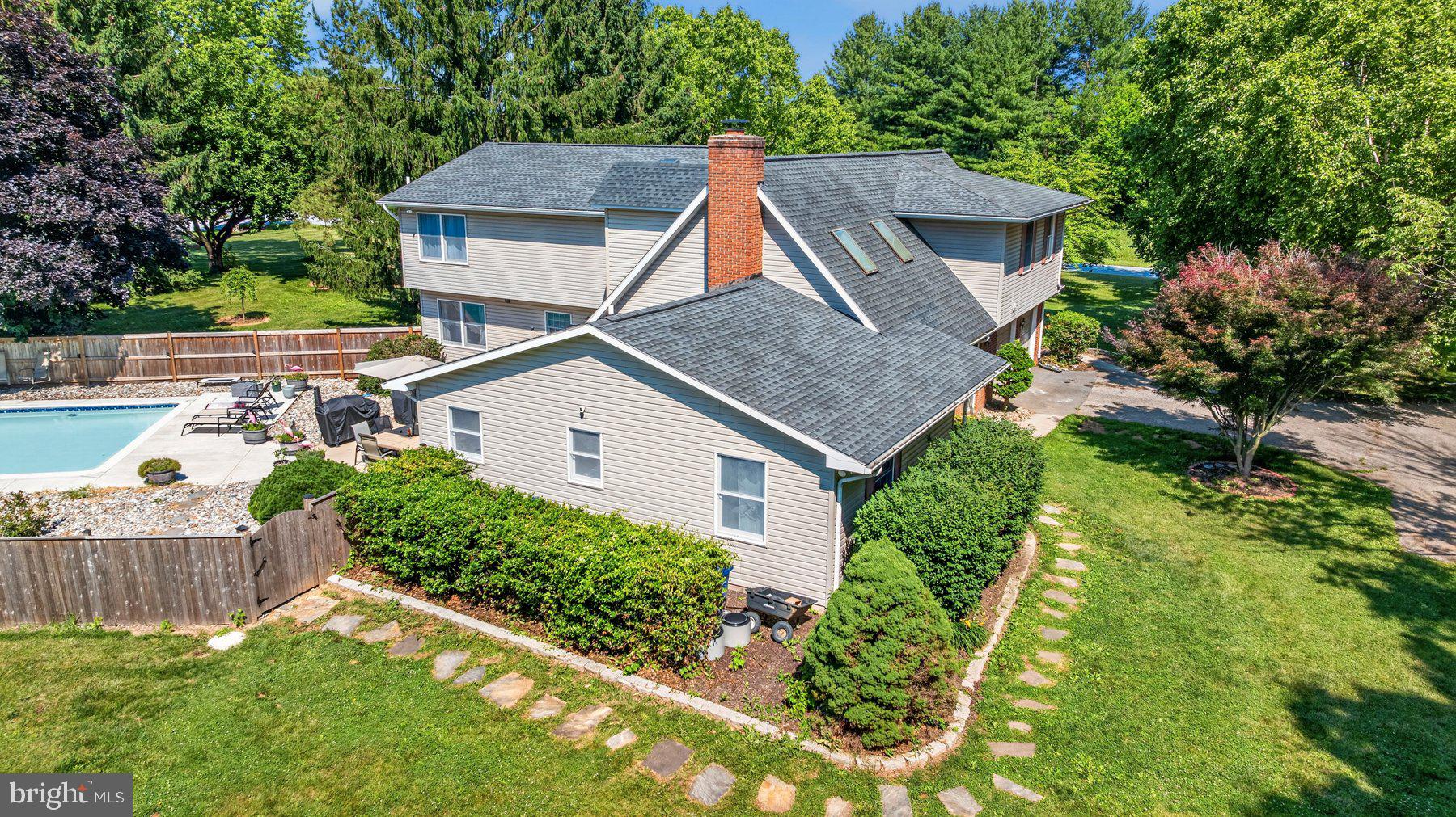 49 Rockland Road Westminster, MD 21158 - Photo 11 of 66 a aerial view of a house with a yard and potted plants