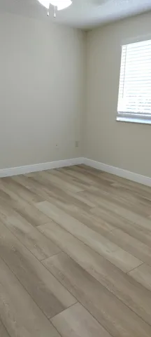 a view of a room that has a window in it