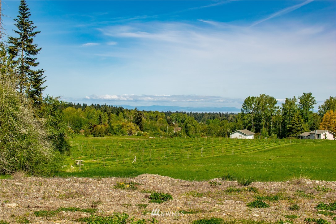 1945 Atterberry Road Sequim, WA 98382 - Photo 22 of 25 a view of a golf course with a lake