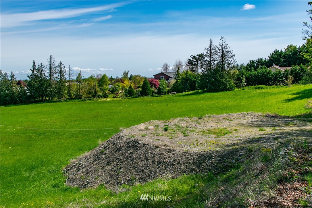 1945 Atterberry Road Sequim, WA 98382 - Photo 24 of 25 a view of a garden with a building in the background