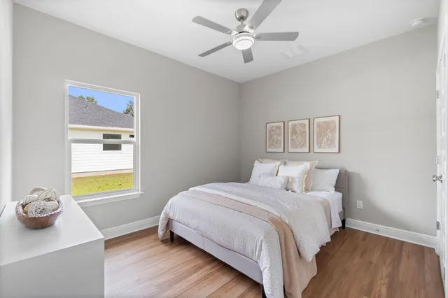 a bedroom with a bed and a table