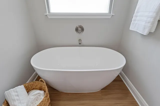 a white bath tub sitting in a bathroom