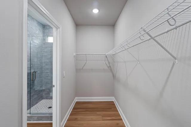 a bathroom with a toilet and a view of bathroom