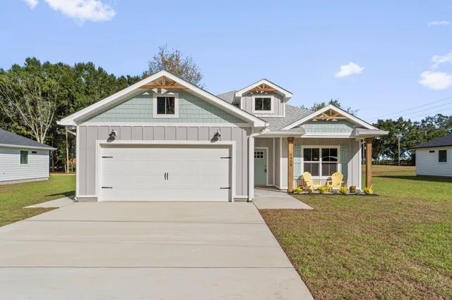 a front view of a house with yard
