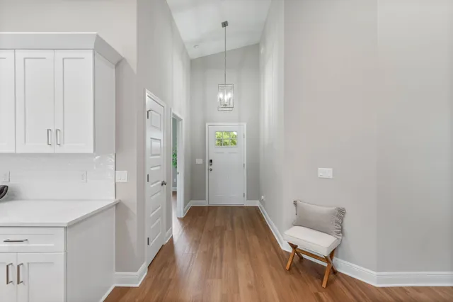 a living room with fireplace furniture and a wooden floor