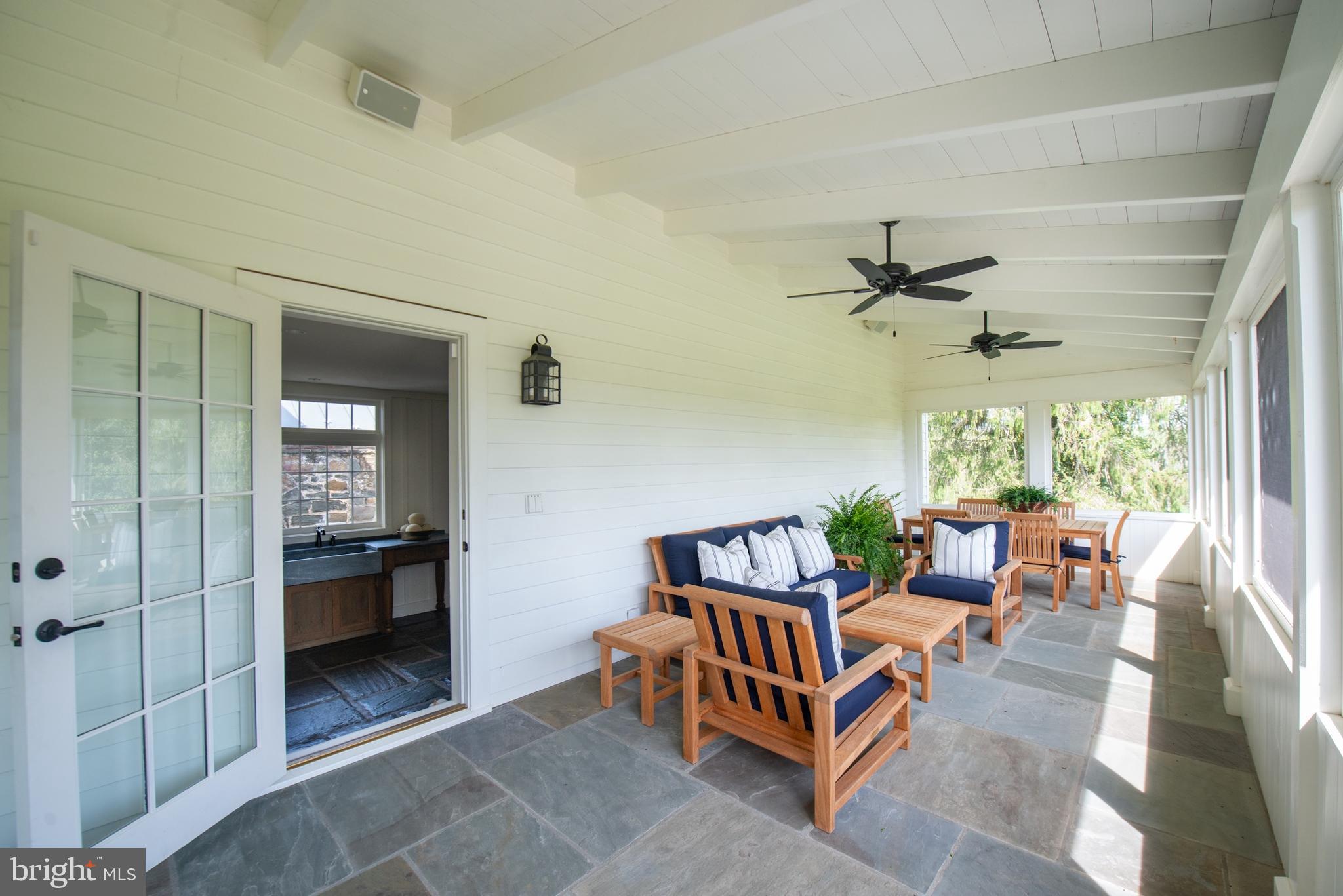 8669 Springs Road Warrenton, VA 20186 - Photo 17 of 50 Screened-In Porch with Living and Dining Areas