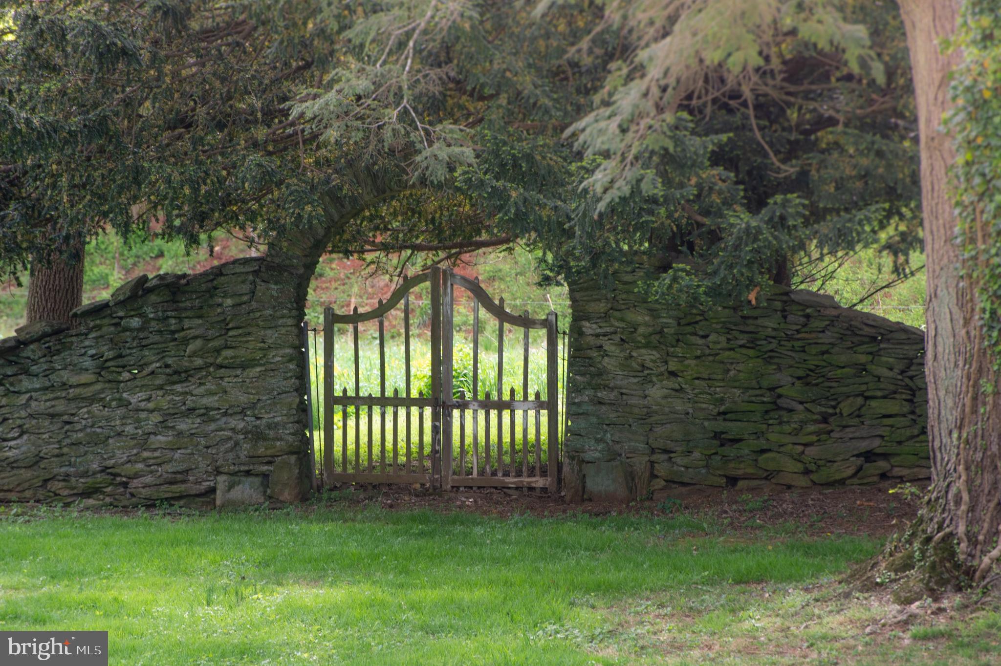 8669 Springs Road Warrenton, VA 20186 - Photo 41 of 50 Walls and Gated Archways Create a Secret Garden