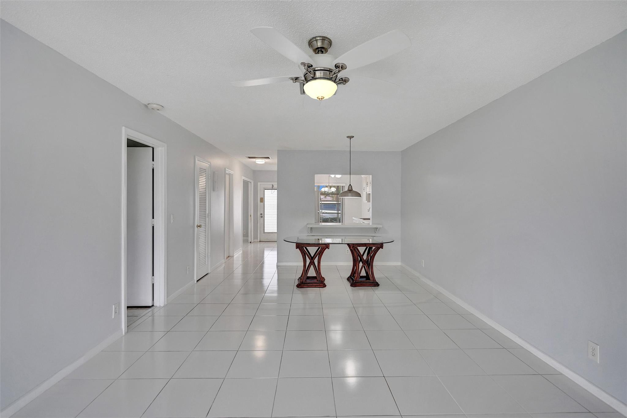 2380 Malayan Drive, Unit B Delray Beach, FL 33445 - Photo 20 of 35 a view of dining room with a table and chairs