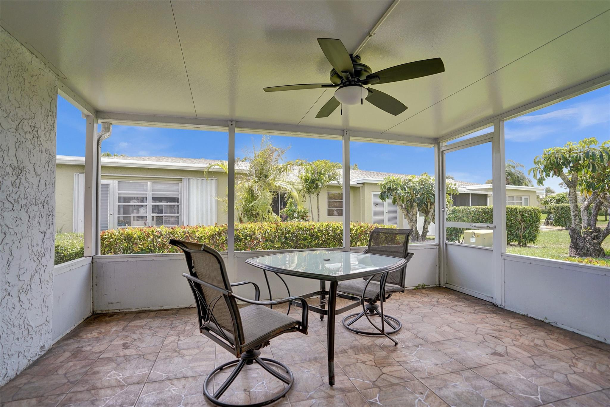 2380 Malayan Drive, Unit B Delray Beach, FL 33445 - Photo 31 of 35 a view of a dining room with furniture window and outside view