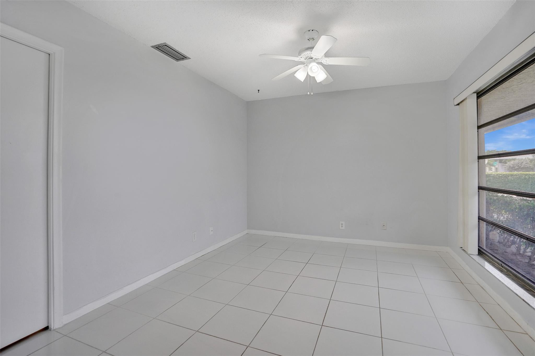 2380 Malayan Drive, Unit B Delray Beach, FL 33445 - Photo 8 of 35 wooden floor in an empty room