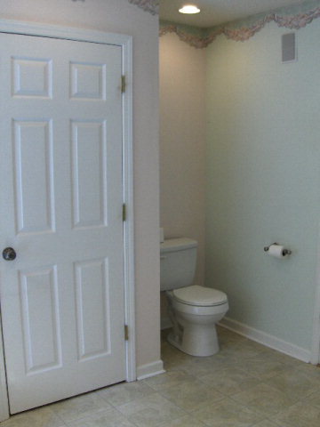 832 Cumslo Road Gray, GA 31032 - Photo 12 of 22 a white toilet sitting next to a bathroom