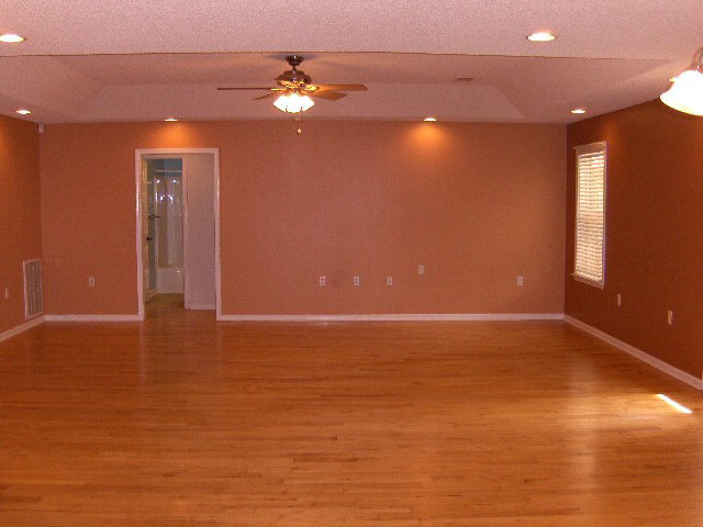 832 Cumslo Road Gray, GA 31032 - Photo 6 of 22 a view of an empty room with window and wooden floor