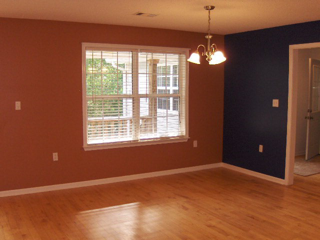 832 Cumslo Road Gray, GA 31032 - Photo 7 of 22 a view of an empty room with window and wooden floor