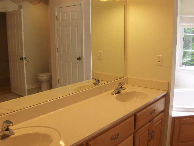 832 Cumslo Road Gray, GA 31032 - Photo 10 of 22 a bathroom with a sink and a mirror