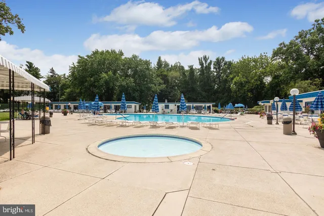 a outdoor space with swimming pool and furniture