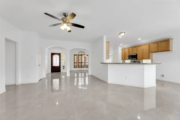 a view of kitchen with cabinets and outdoor space