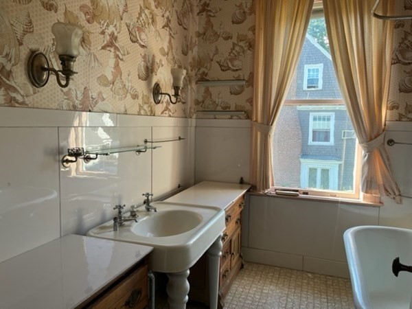 325 Longhill Street Springfield, MA 01108 - Photo 29 of 39 a bathroom with a sink a vanity and a mirror