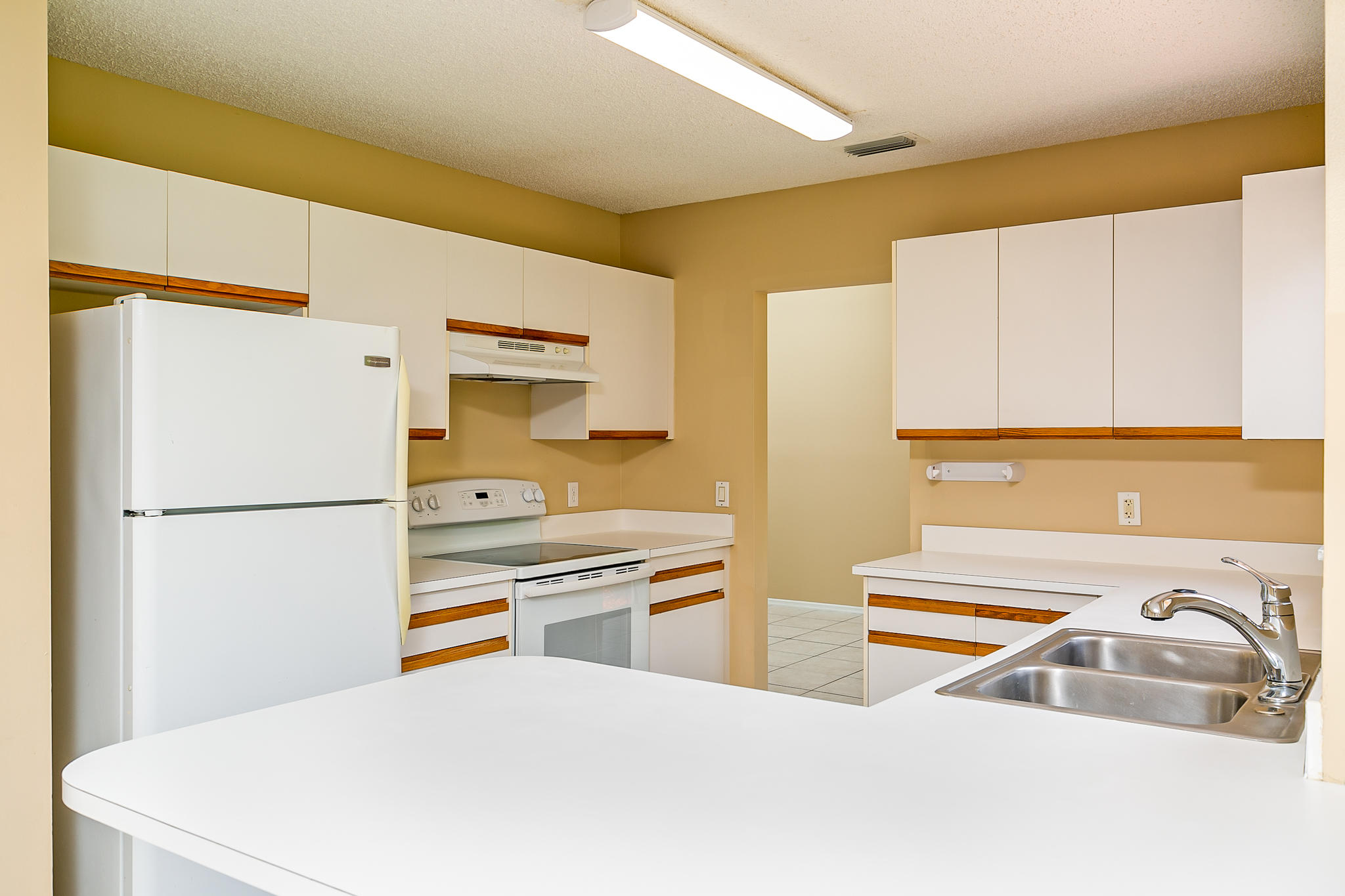 2904 Southeast Bella Road Port St. Lucie, FL 34984 - Photo 13 of 30 a kitchen with stainless steel appliances a refrigerator and a stove