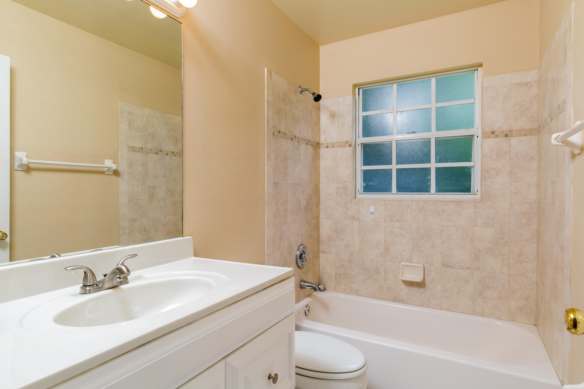 2904 Southeast Bella Road Port St. Lucie, FL 34984 - Photo 18 of 30 a bathroom with a granite countertop sink toilet and shower