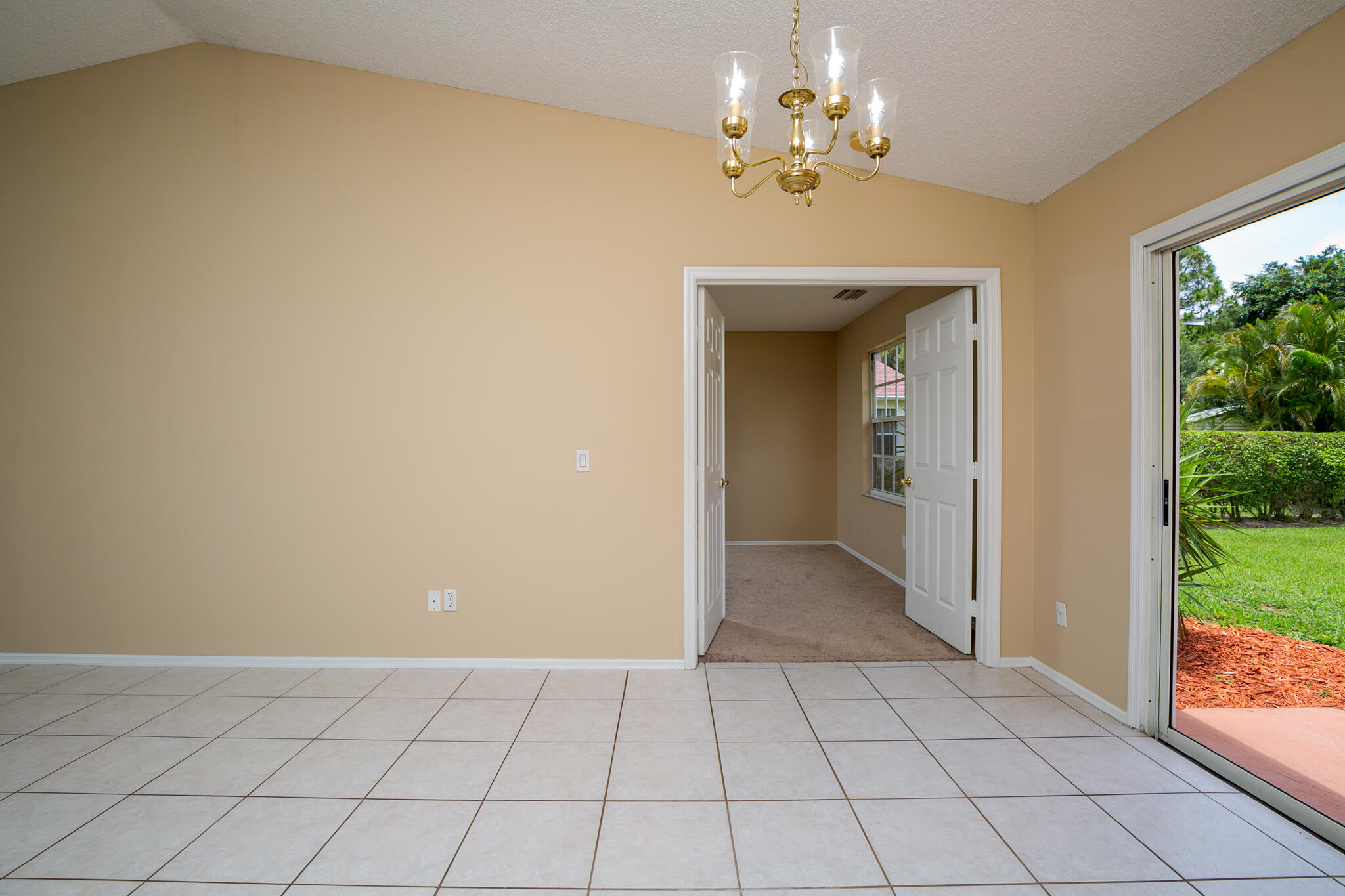 2904 Southeast Bella Road Port St. Lucie, FL 34984 - Photo 20 of 30 wooden floor in a room with a chandelier