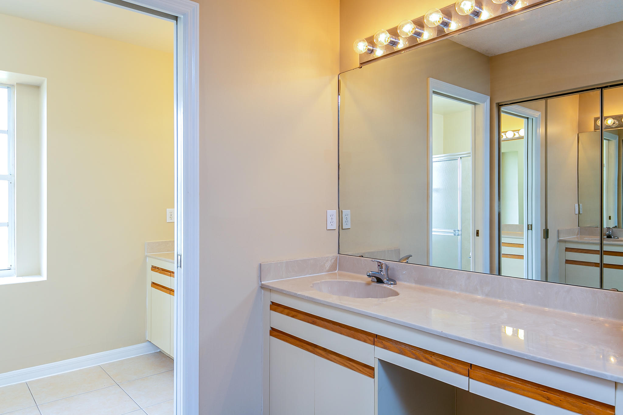 2904 Southeast Bella Road Port St. Lucie, FL 34984 - Photo 22 of 30 a bathroom with a sink and a mirror