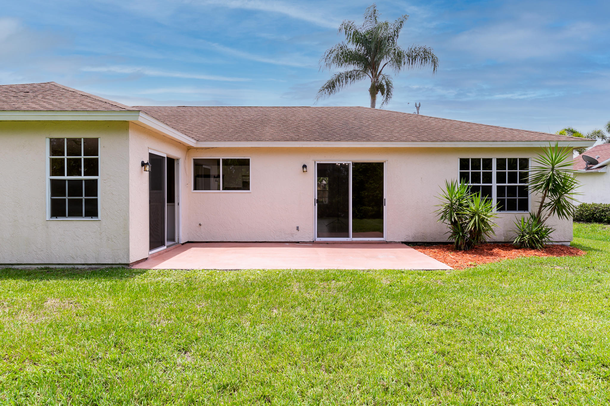 2904 Southeast Bella Road Port St. Lucie, FL 34984 - Photo 25 of 30 a house view with a garden space