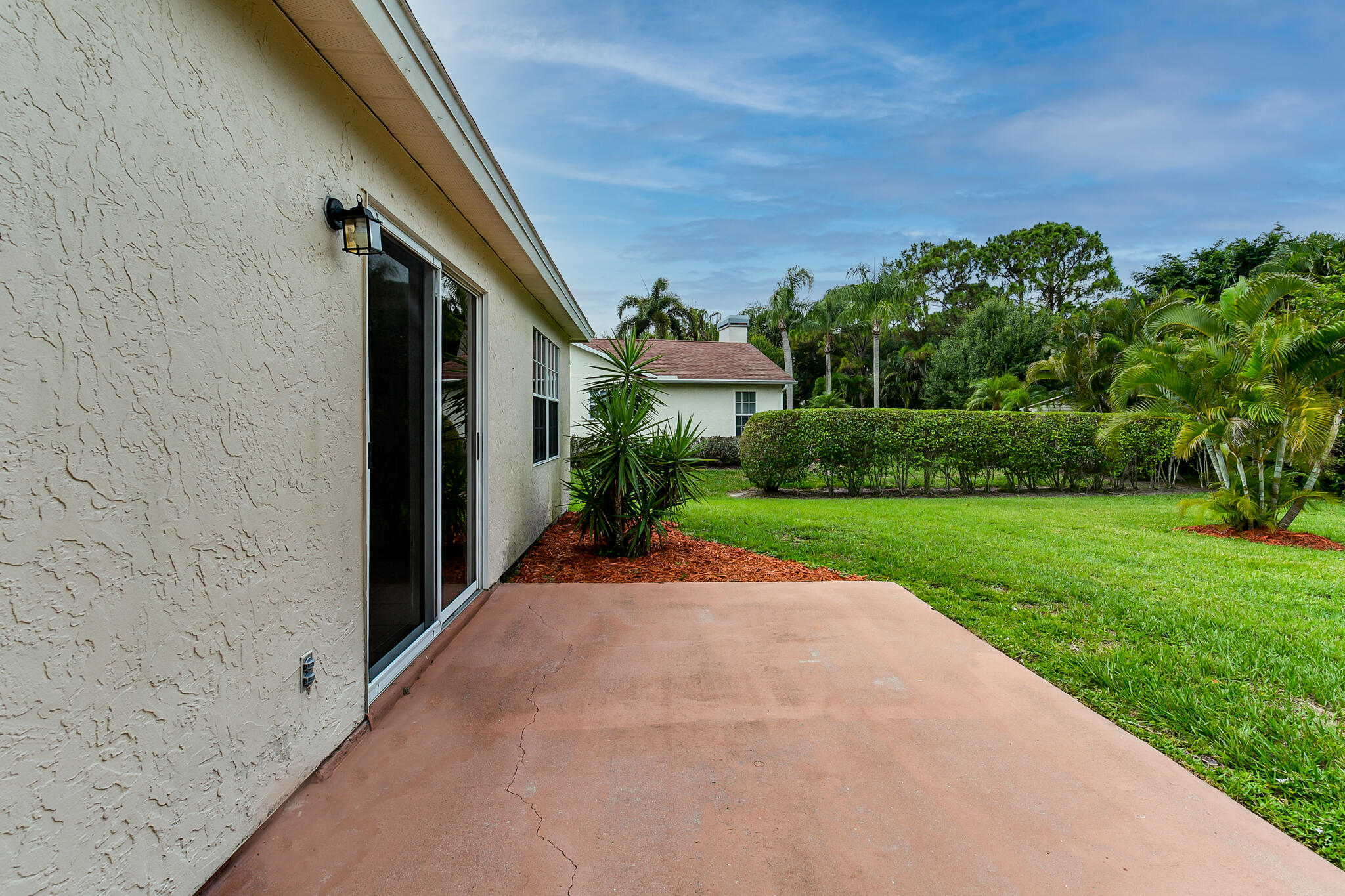 2904 Southeast Bella Road Port St. Lucie, FL 34984 - Photo 28 of 30 a view of a yard with potted plants