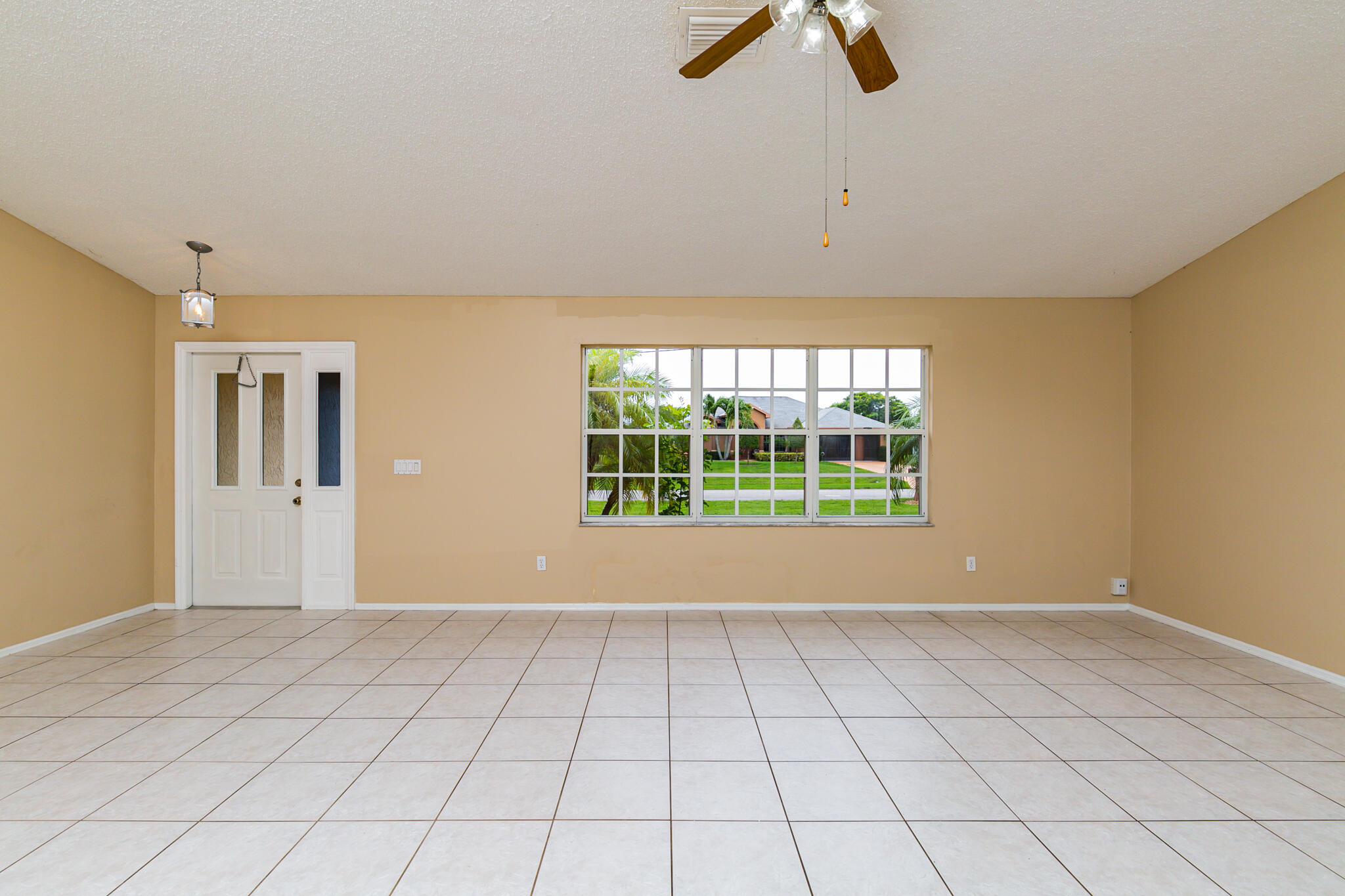 2904 Southeast Bella Road Port St. Lucie, FL 34984 - Photo 5 of 30 a view of an empty room with a window