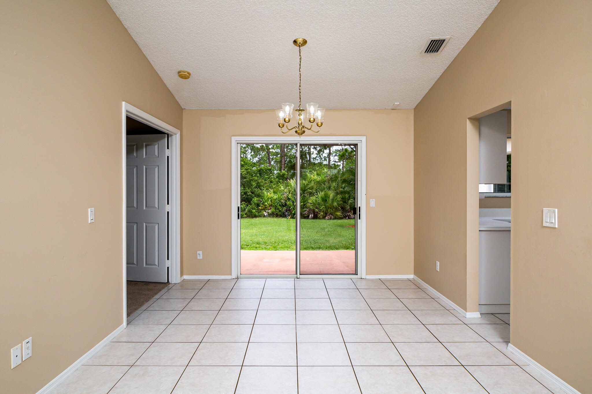 2904 Southeast Bella Road Port St. Lucie, FL 34984 - Photo 9 of 30 a view of an empty room with a window
