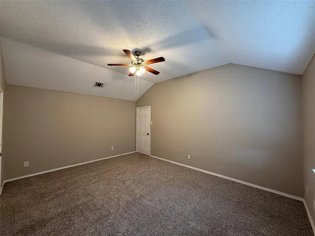 a bathroom with a toilet and bathtub