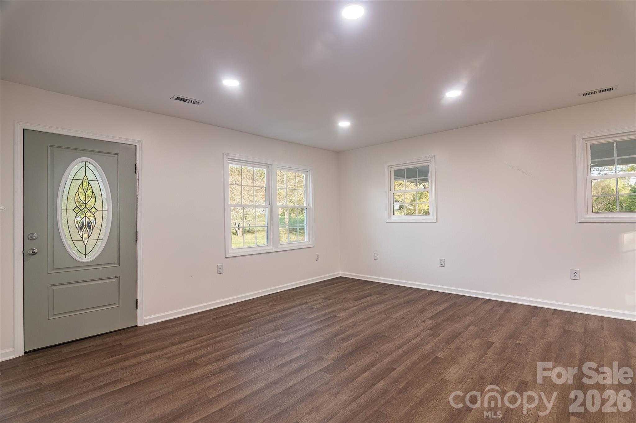 281 Jack McKinney Road Forest City, NC 28043 - Photo 14 of 37 an empty room with wooden floor and window