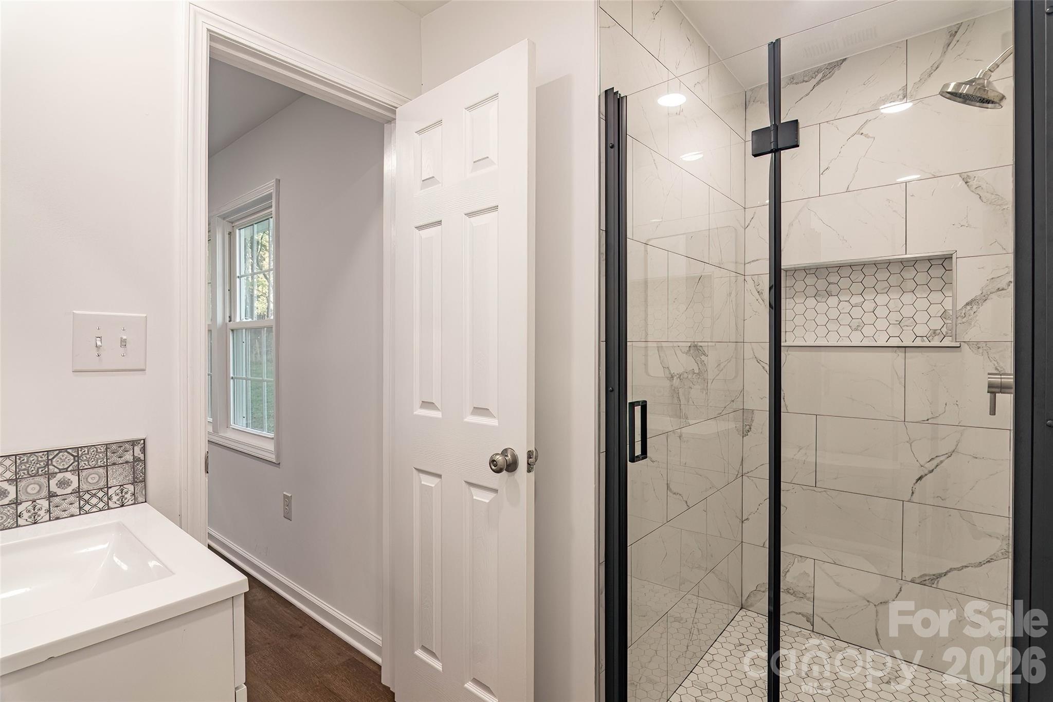 281 Jack McKinney Road Forest City, NC 28043 - Photo 17 of 37 a bathroom with a shower and a sink