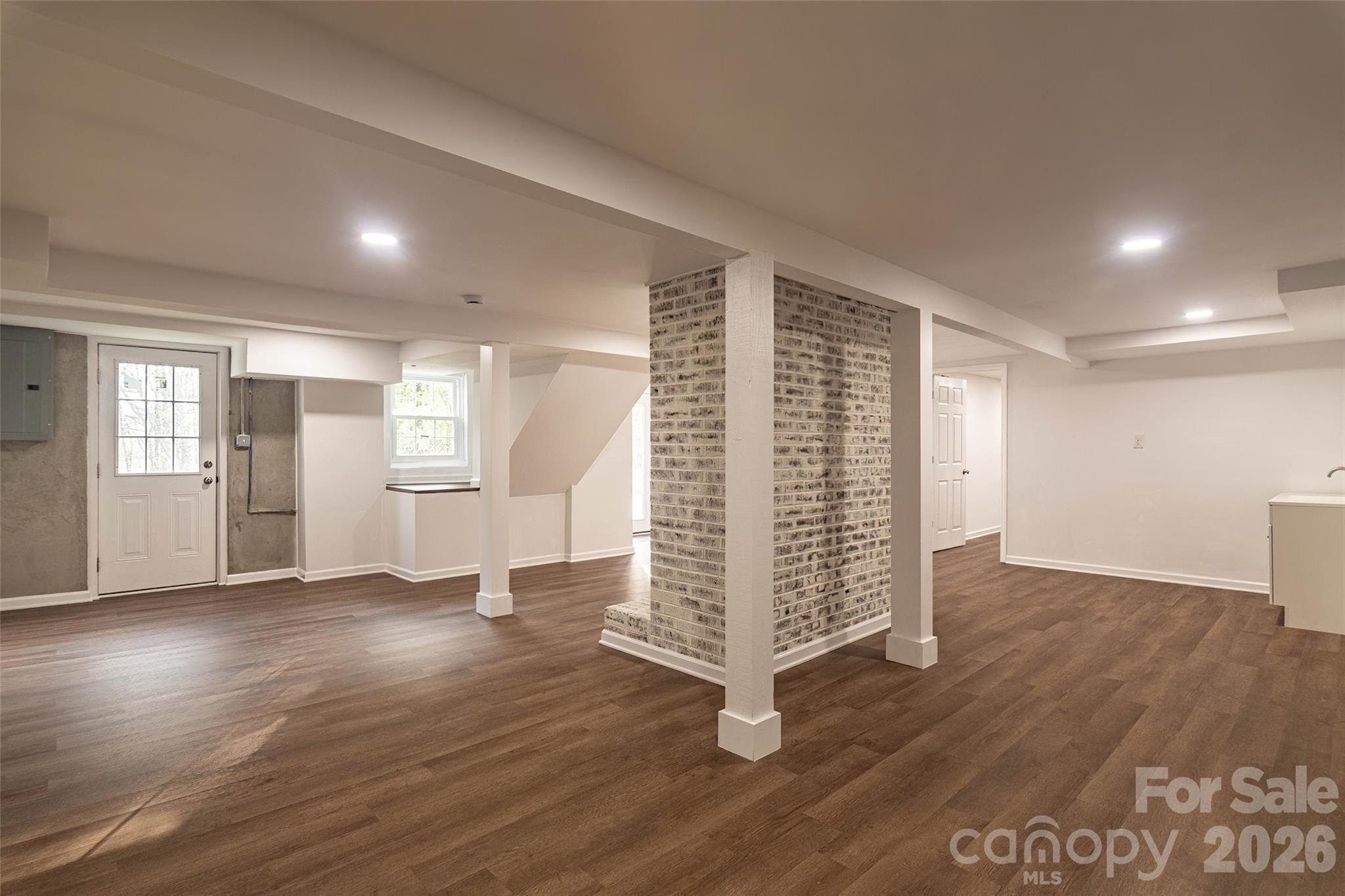 281 Jack McKinney Road Forest City, NC 28043 - Photo 26 of 37 an empty room with wooden floor and windows