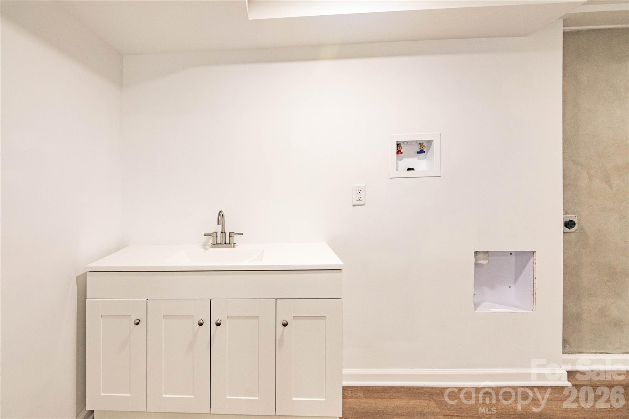 281 Jack McKinney Road Forest City, NC 28043 - Photo 27 of 37 a bathroom with a sink and a mirror