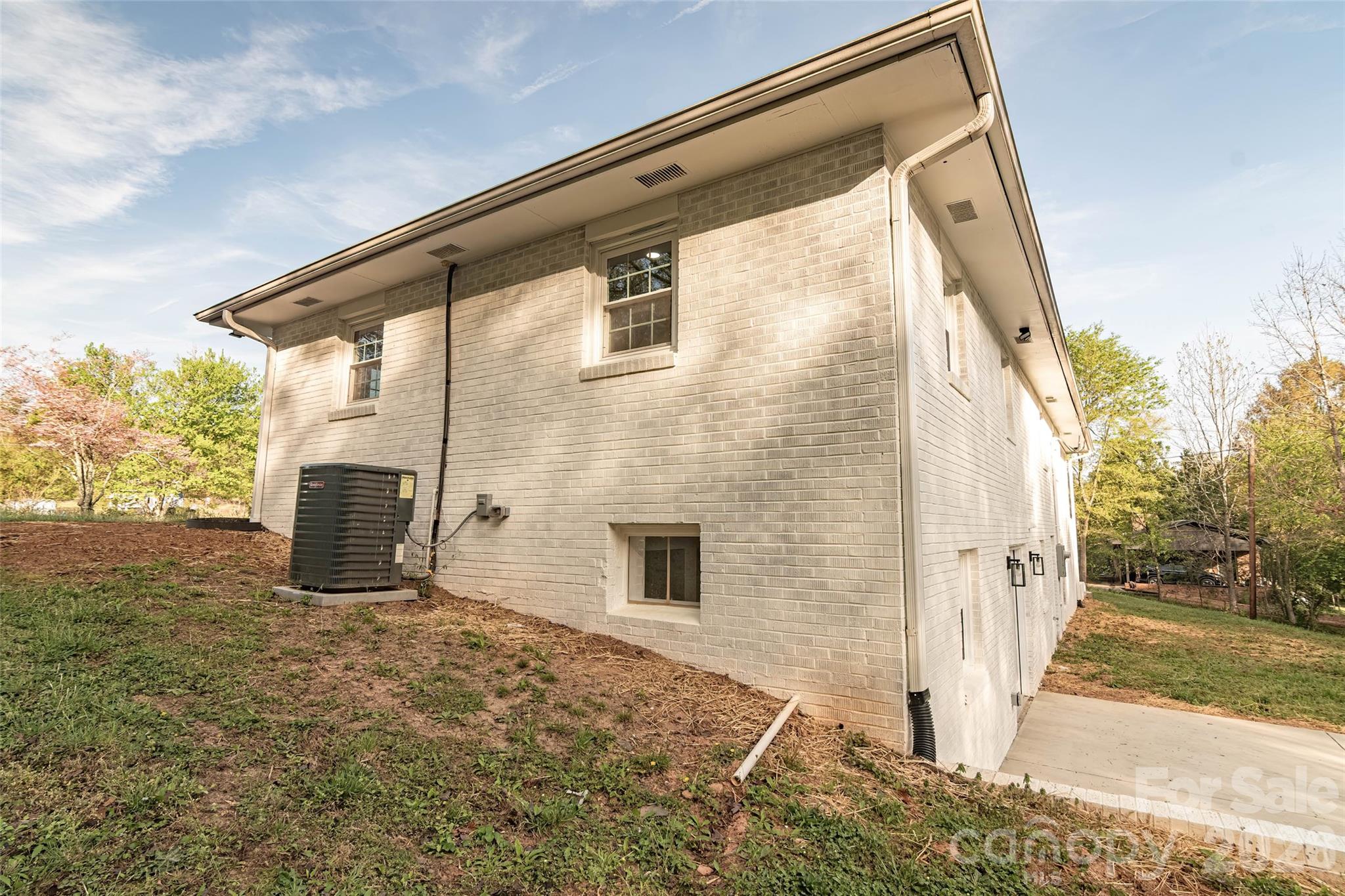 281 Jack McKinney Road Forest City, NC 28043 - Photo 34 of 37 a backyard of a house with seating space