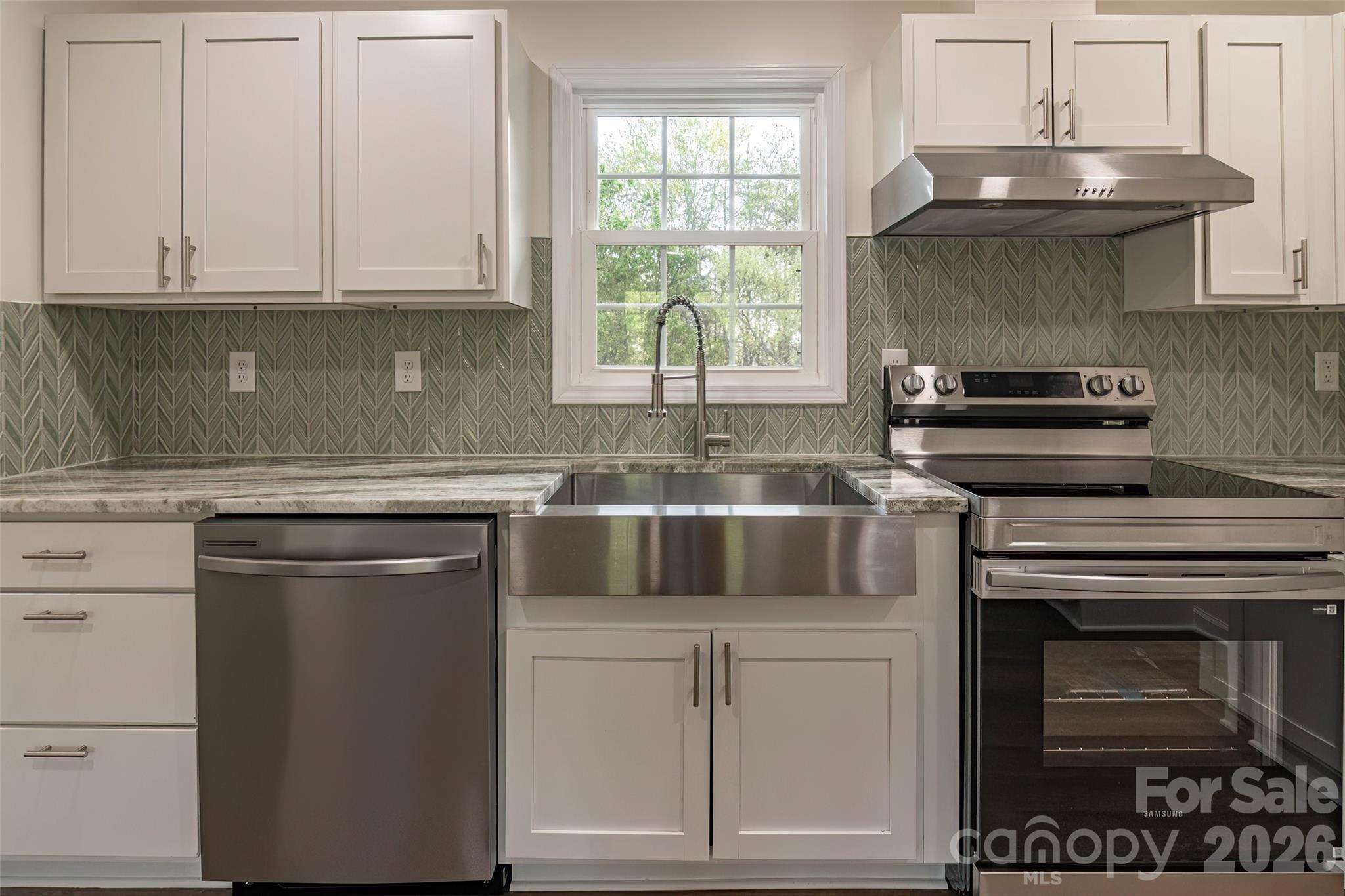 281 Jack McKinney Road Forest City, NC 28043 - Photo 10 of 37 a kitchen with appliances cabinets and a window