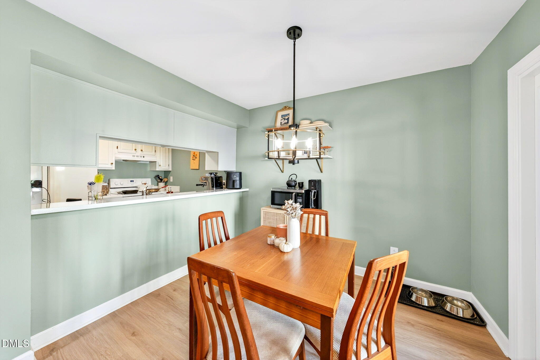 3307 Tarleton West Durham, NC 27713 - Photo 12 of 39 a view of a dining room with furniture a chandelier and wooden floor