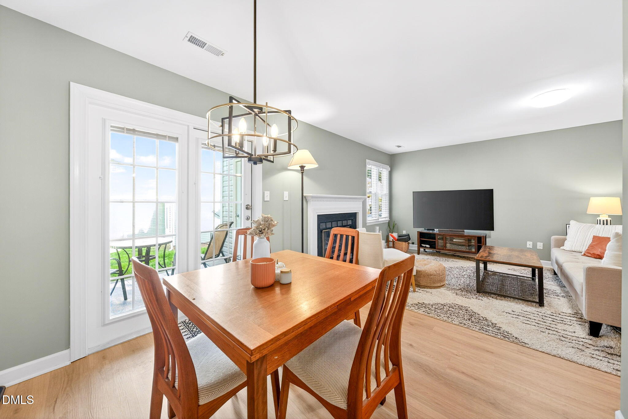 3307 Tarleton West Durham, NC 27713 - Photo 14 of 39 a dining room with furniture a chandelier and wooden floor