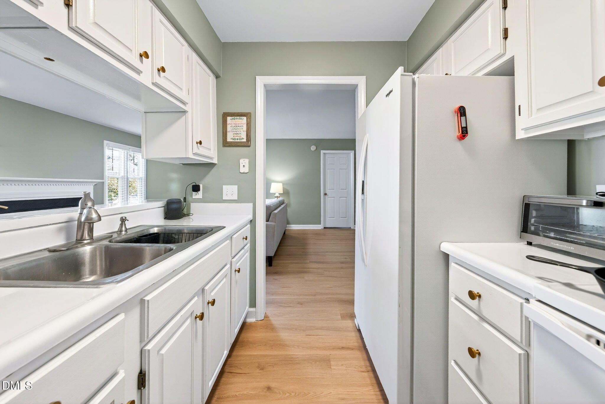 3307 Tarleton West Durham, NC 27713 - Photo 18 of 39 a kitchen with kitchen island a sink stove and refrigerator