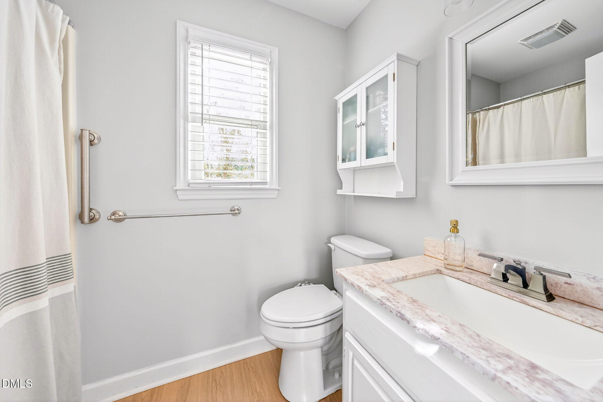 3307 Tarleton West Durham, NC 27713 - Photo 21 of 39 a bathroom with a sink a toilet and a window
