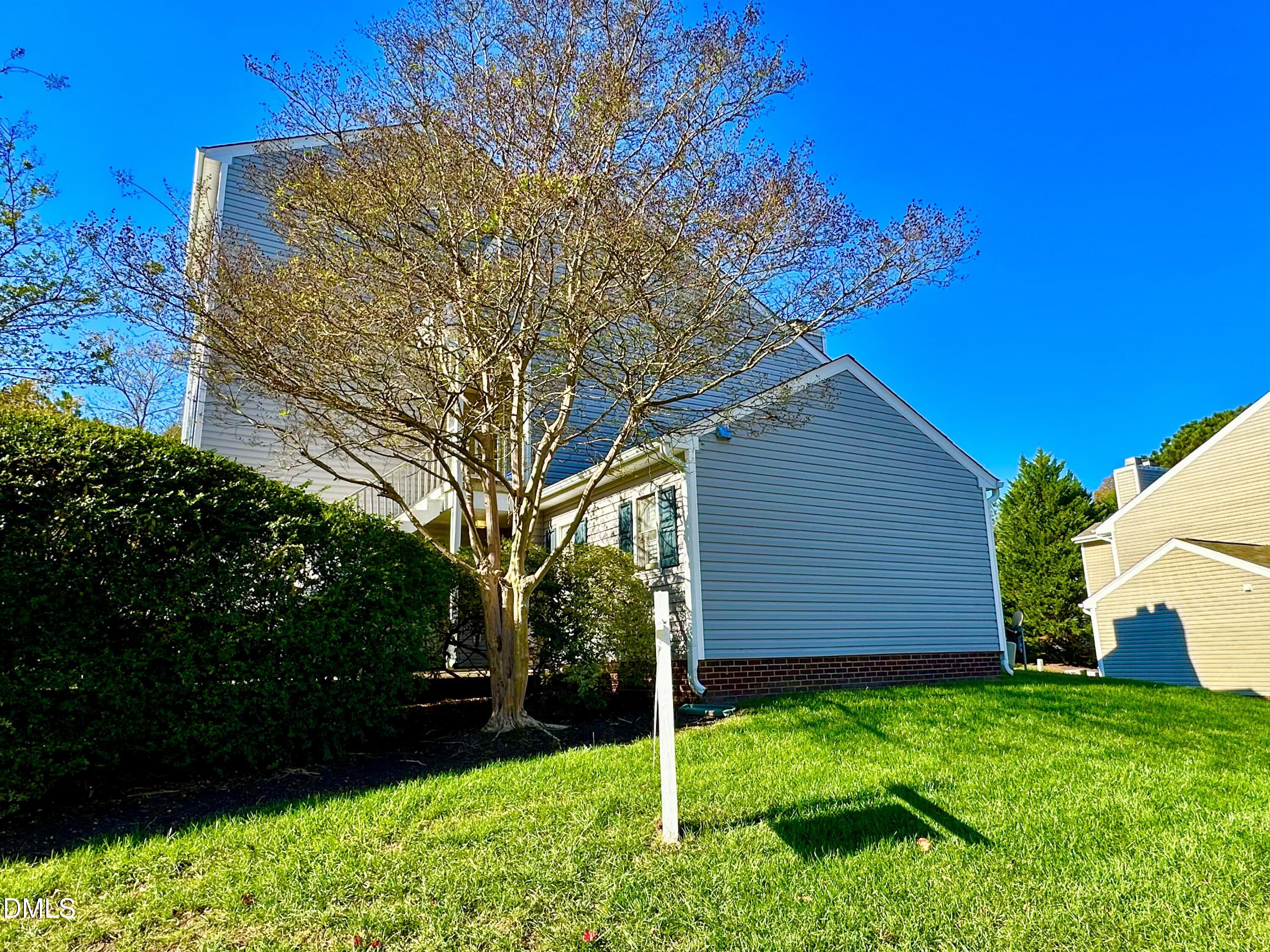 3307 Tarleton West Durham, NC 27713 - Photo 37 of 39 a backyard of a house with plants and large tree