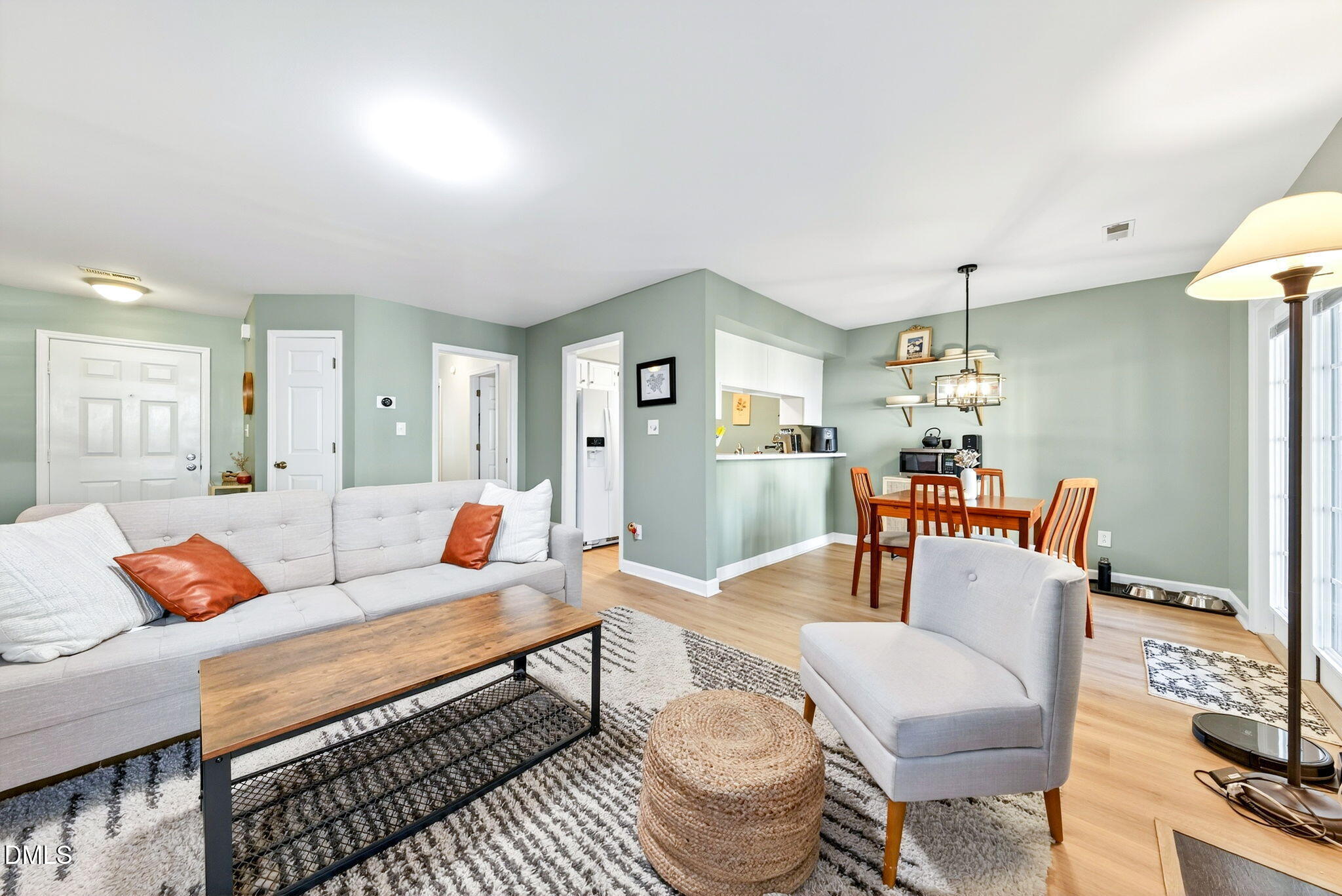 3307 Tarleton West Durham, NC 27713 - Photo 7 of 39 a living room with furniture a dining table and a chandelier