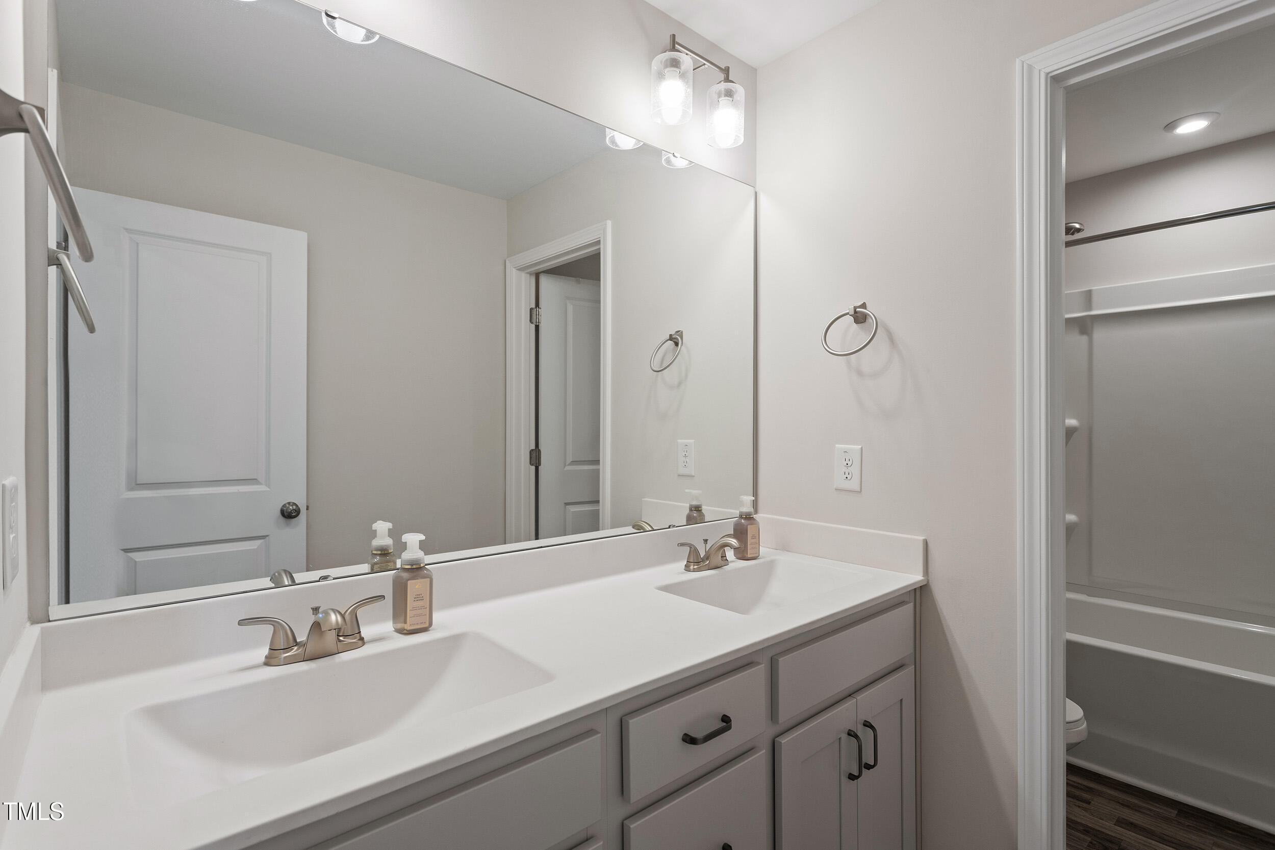 201 Northview Drive Middlesex, NC 27557 - Photo 11 of 25 a bathroom with a sink double vanity and a mirror
