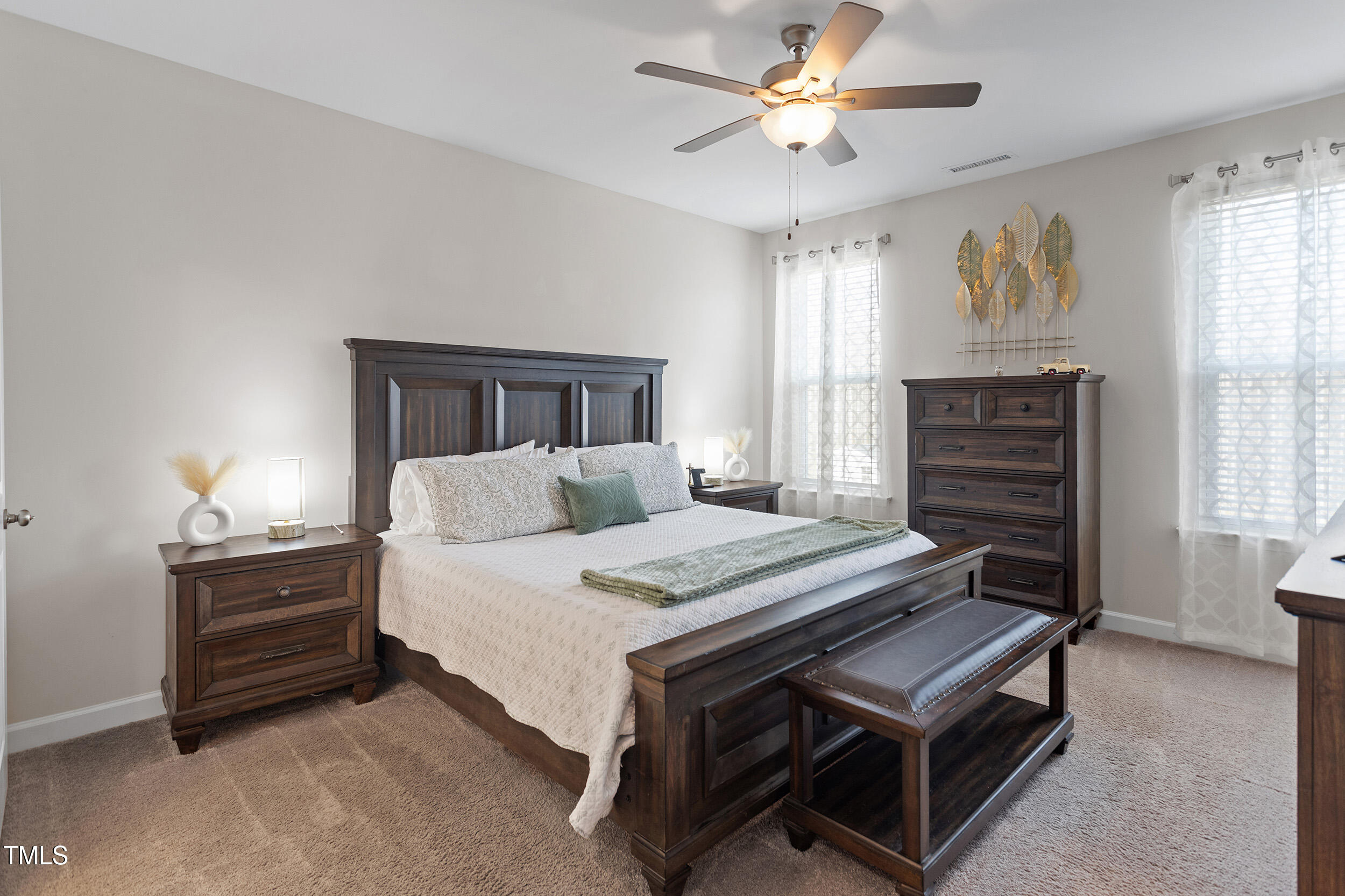201 Northview Drive Middlesex, NC 27557 - Photo 12 of 25 a bedroom with a bed and a chandelier