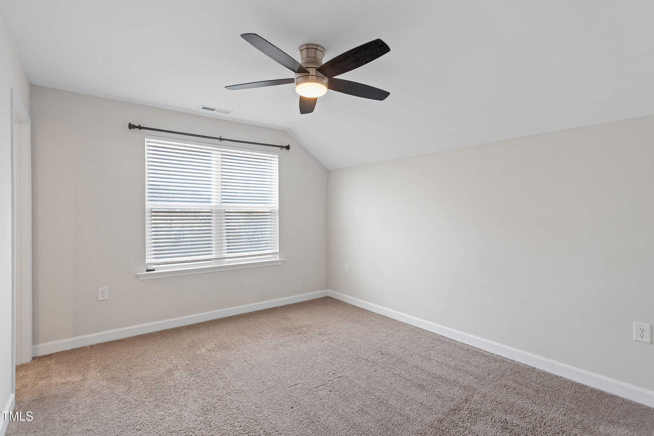 201 Northview Drive Middlesex, NC 27557 - Photo 14 of 25 an empty room with ceiling fan and windows