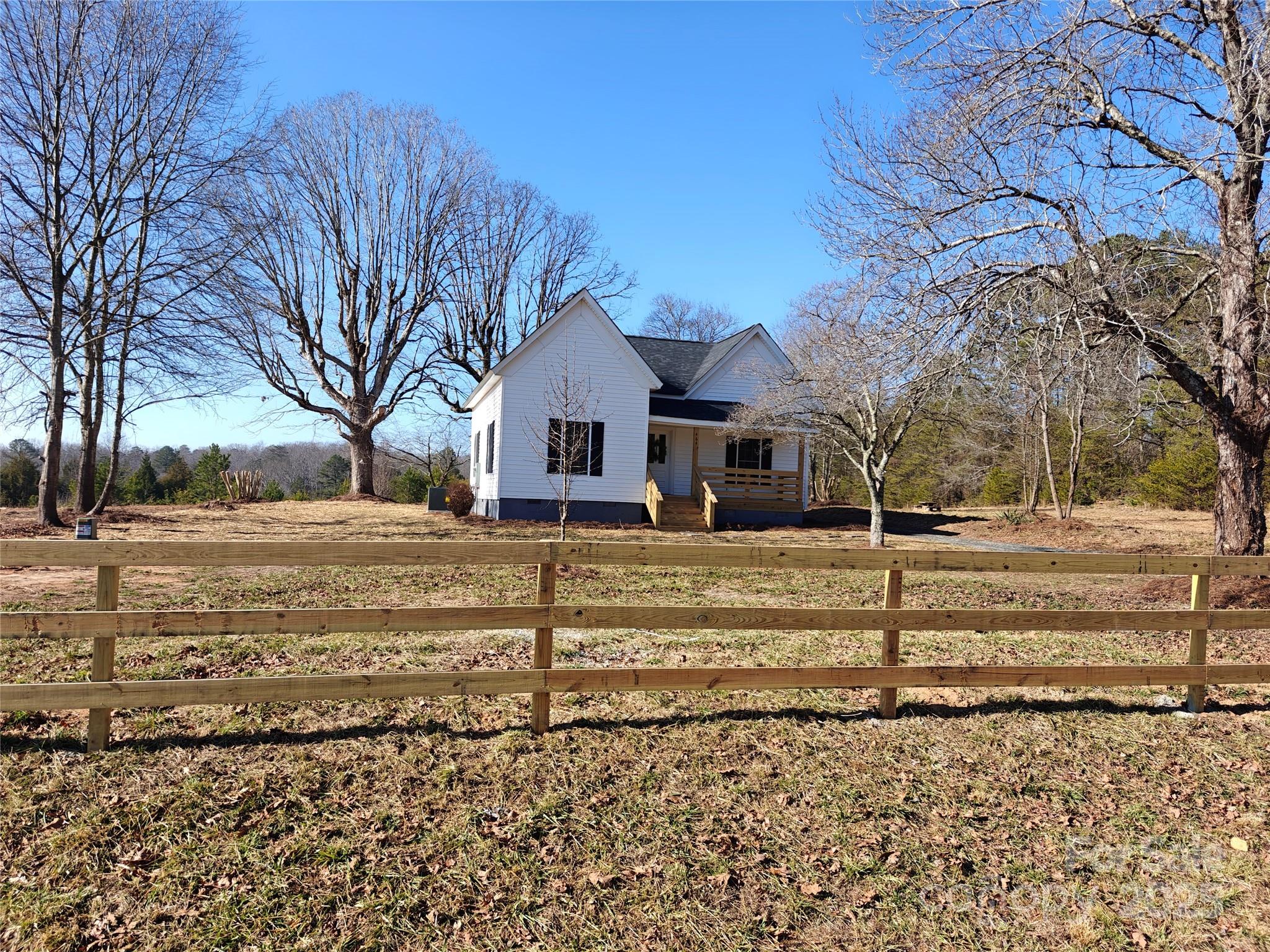 464 Hamrick Road Mooresboro, NC 28114 - Photo 11 of 48 a view of a house with a yard covered with snow