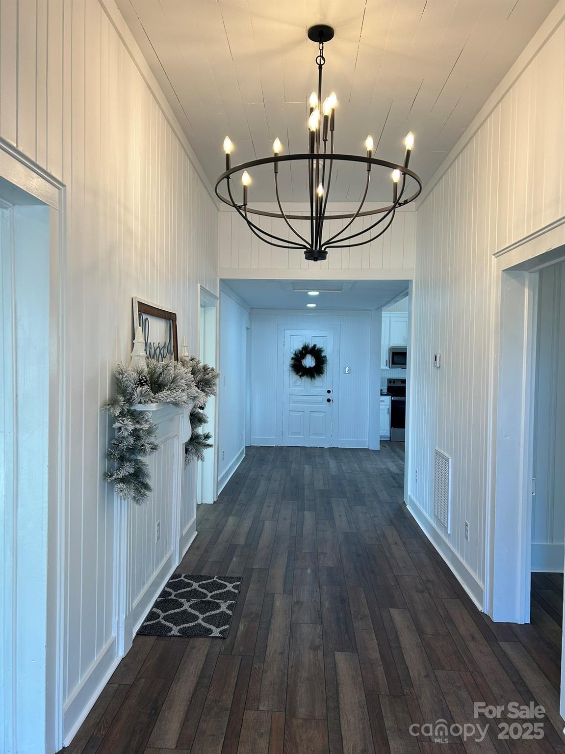 464 Hamrick Road Mooresboro, NC 28114 - Photo 17 of 48 a view of a chandelier and wooden floor in a kitchen