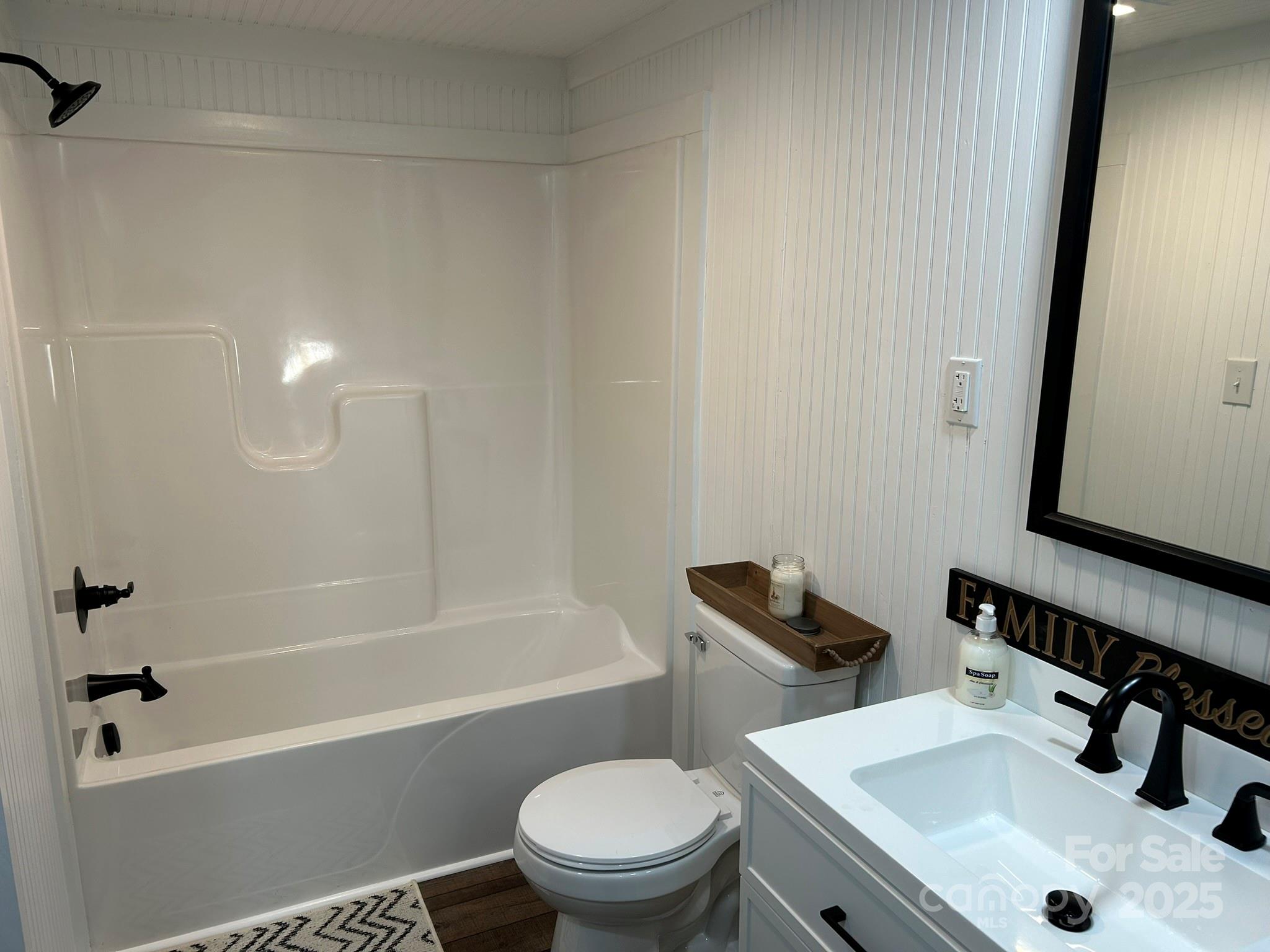 464 Hamrick Road Mooresboro, NC 28114 - Photo 26 of 48 a bathroom with a sink a toilet and a bathtub