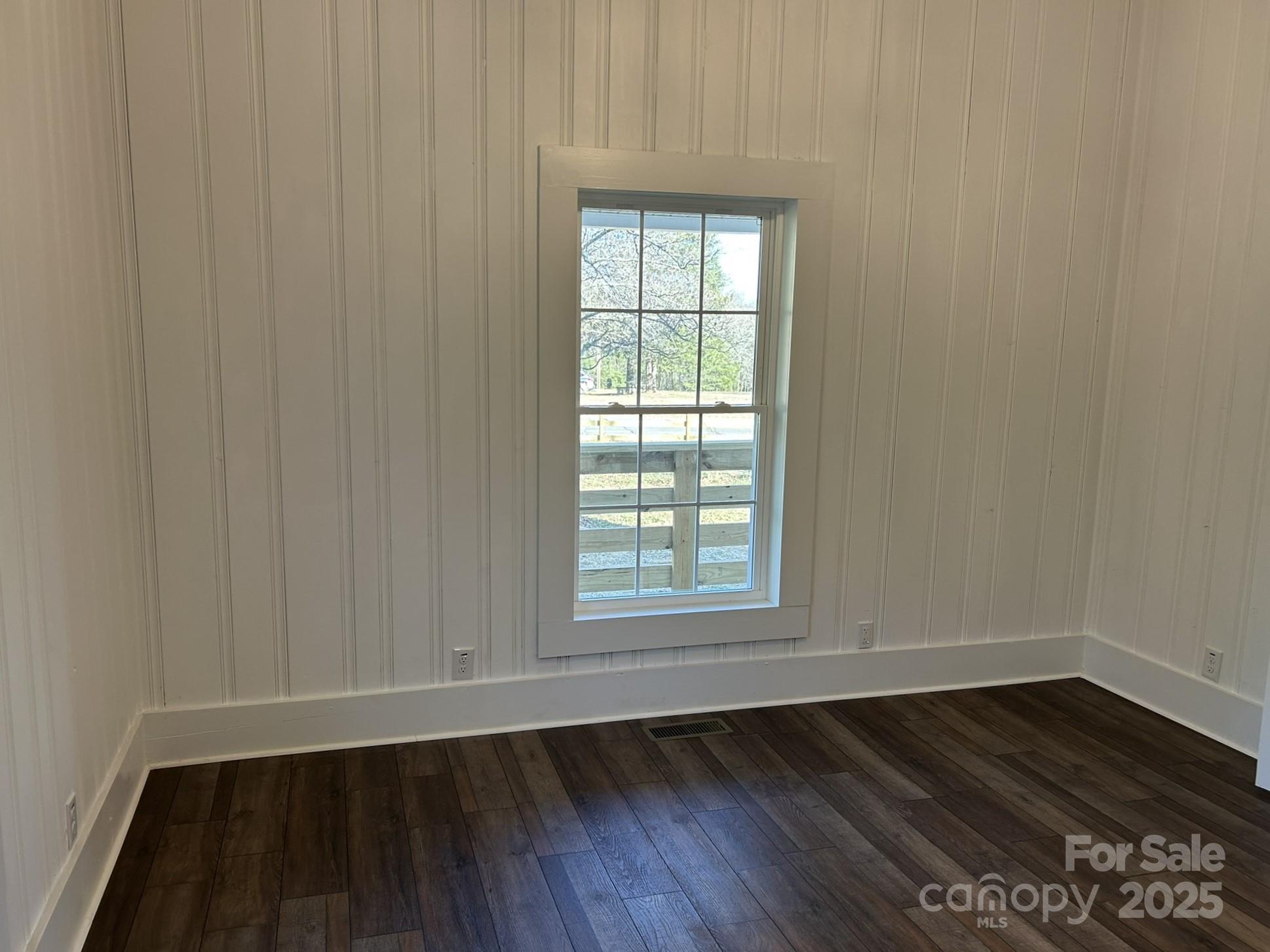 464 Hamrick Road Mooresboro, NC 28114 - Photo 34 of 48 an empty room with wooden floor and windows